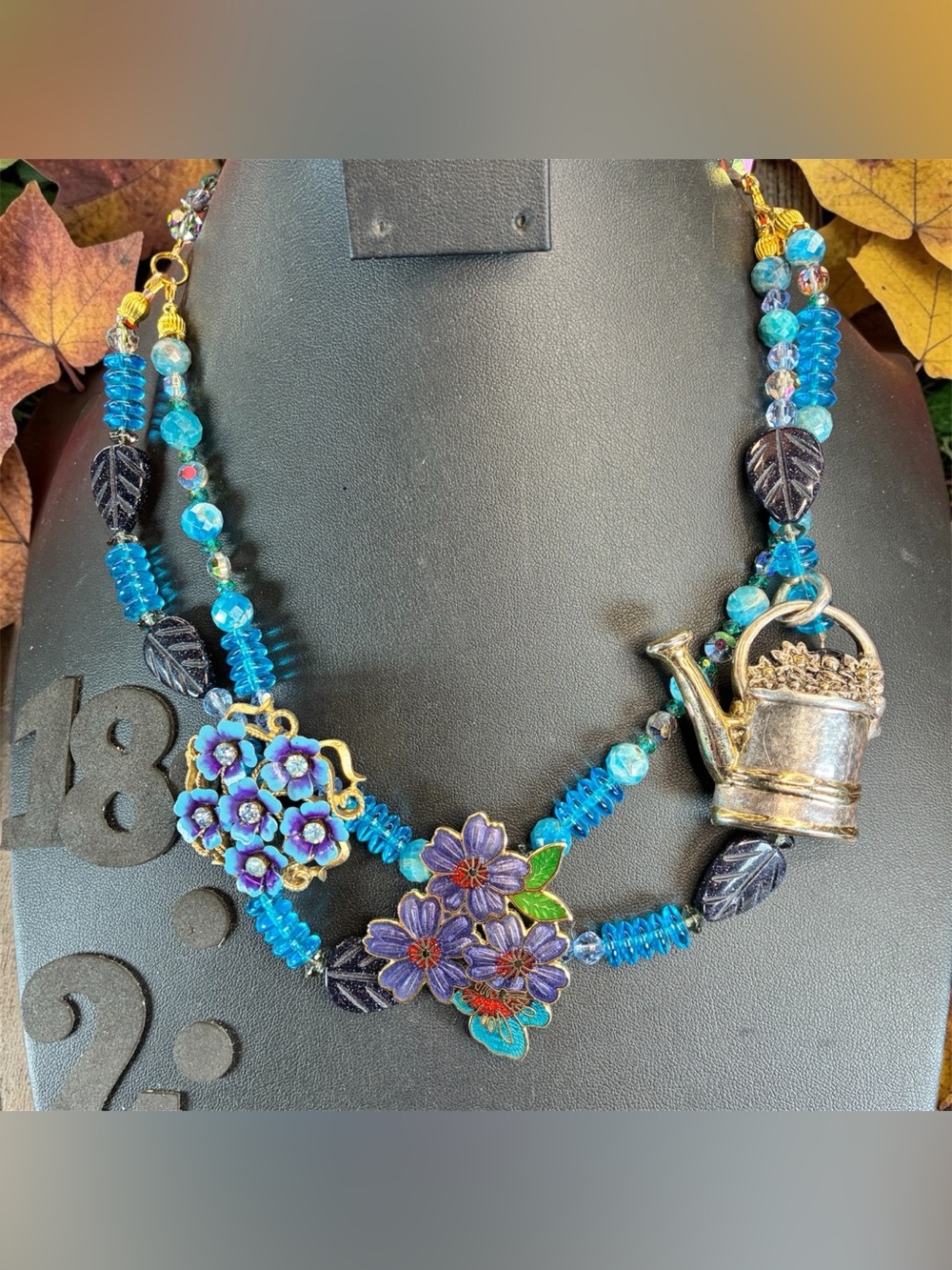 Handcrafted Blue Floral Pendant Necklace with Teapot Accent